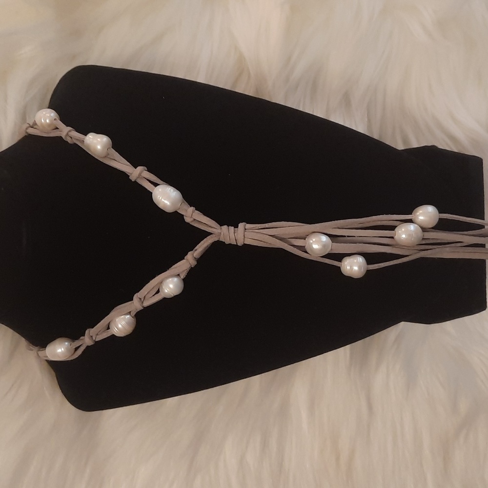 Waterfall of pearls necklace on long gray leather multi tiered cords.